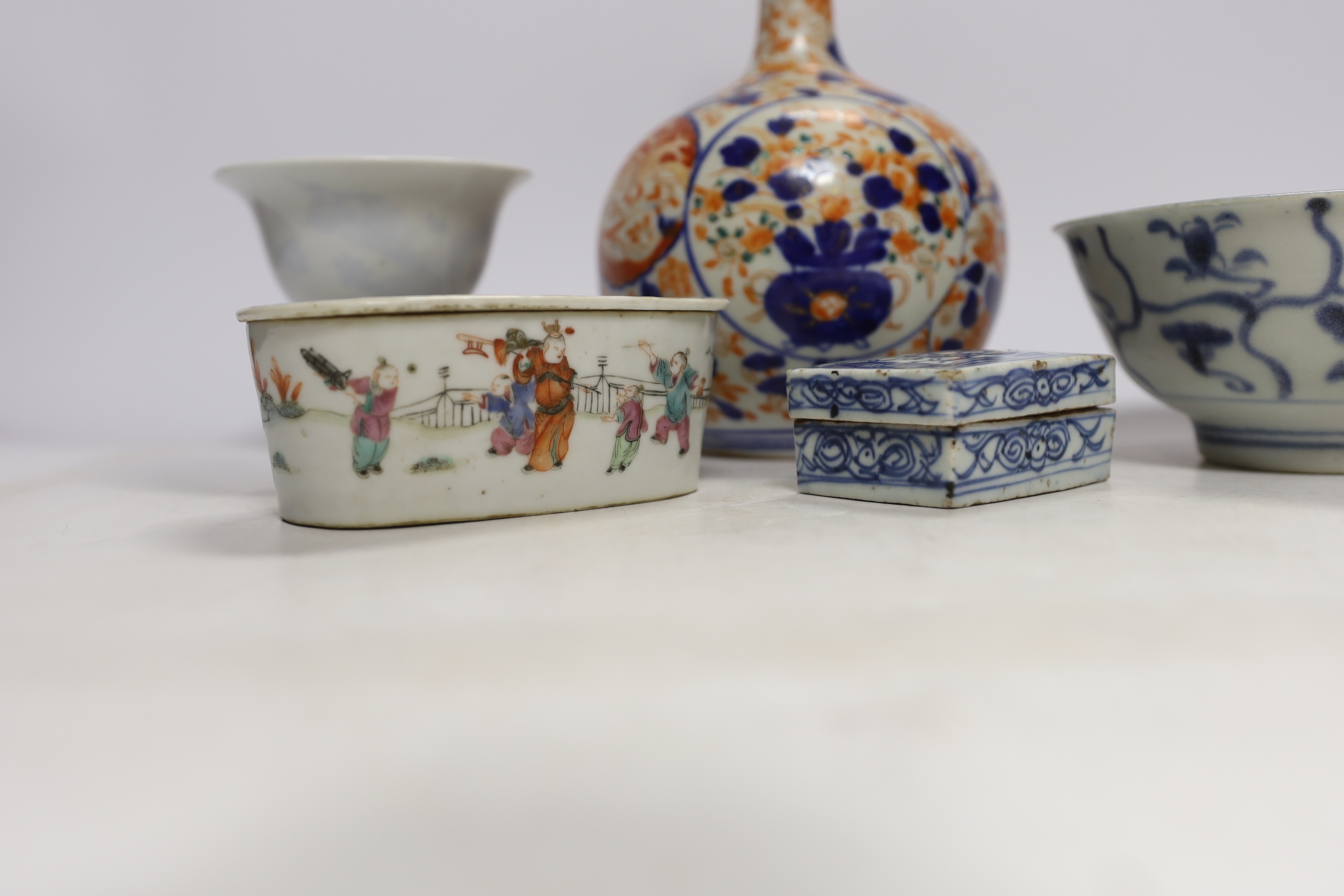 A Chinese Tek Sing Cargo bowl, a Chinese famille Rose Jar and cover, late 19th century, a stem cup with hidden decoration a box and cover and a Japanese Imari bottle vase.